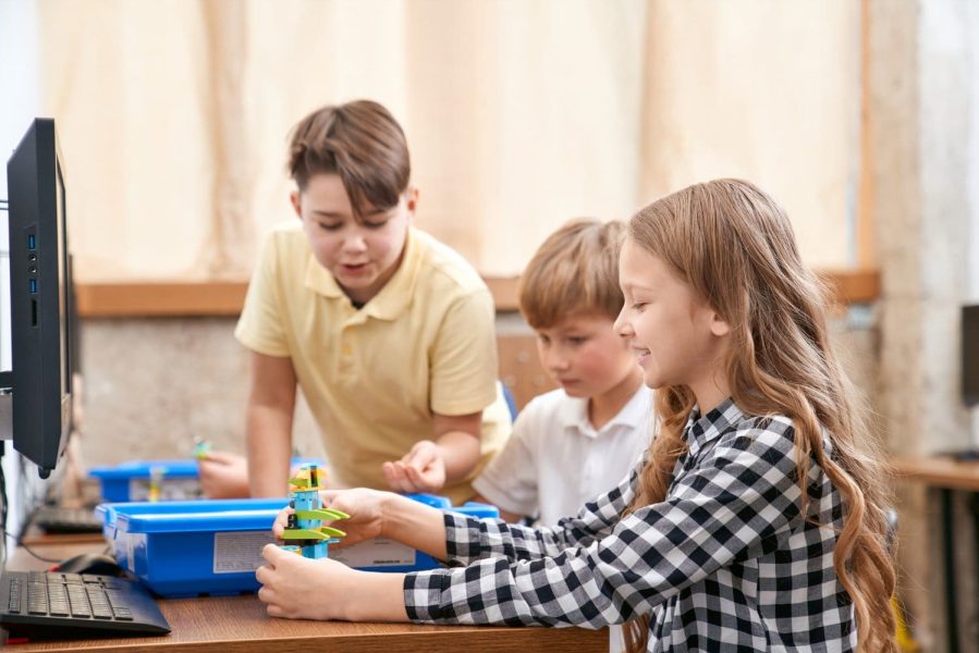 Children Working On a Building Kit